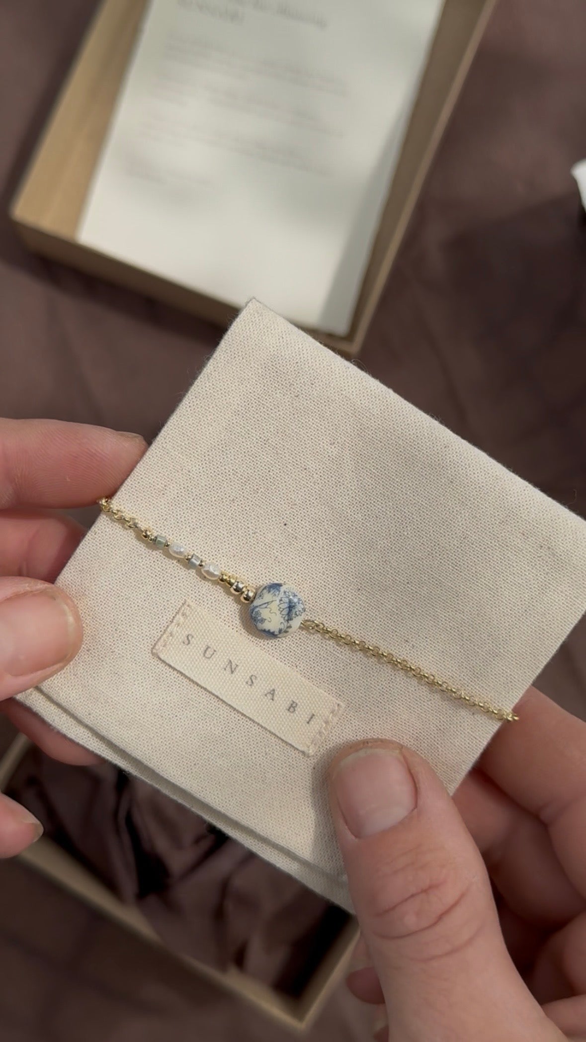 SUNSABI One of a Kind bracelet with a vintage blue and white porcelain bead, pearl and gold-filled chain