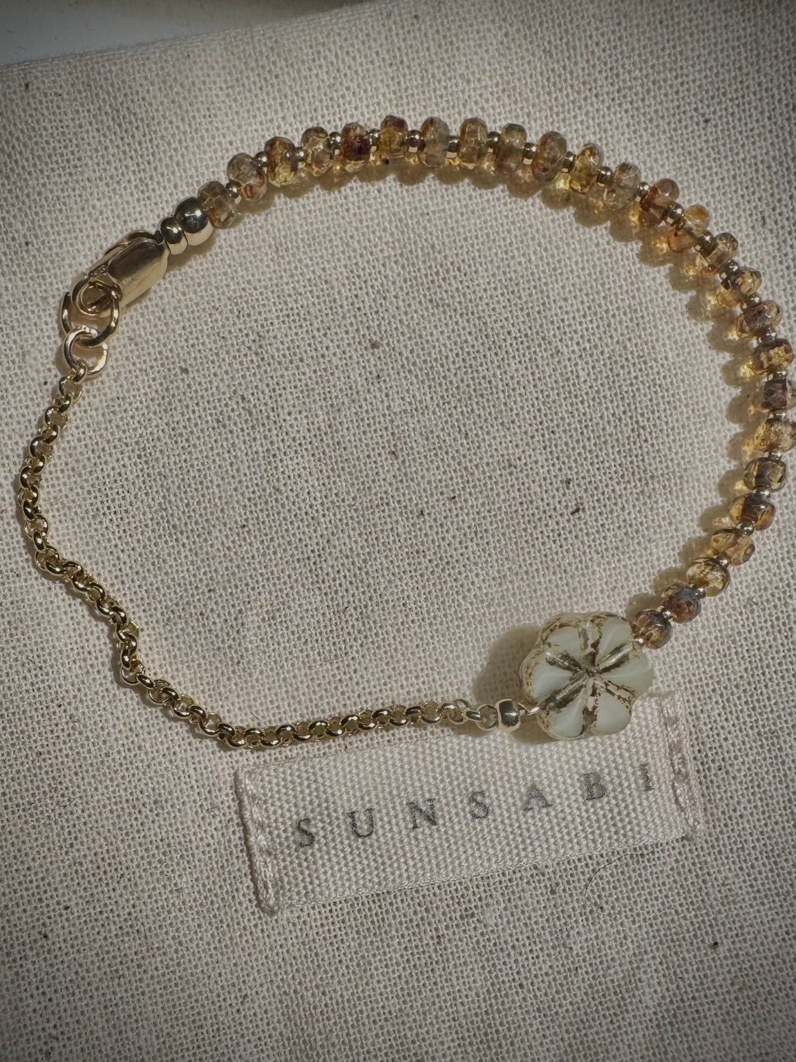 SUNSABI SUN BEAM child bracelet with honey-toned glass beads, Picasso floral glass focal and 14k gold-filled rolo chain