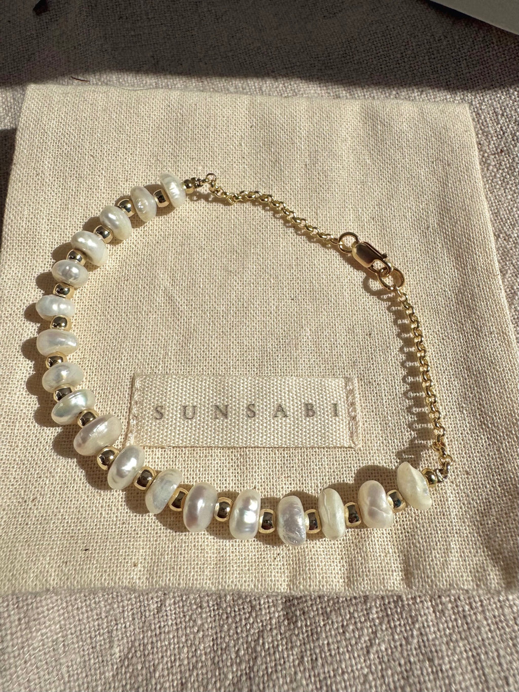Eighteen freshwater pearl bracelet with 14k gold-filled chain and clasp