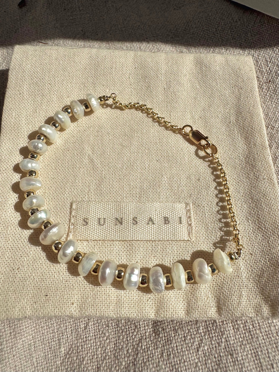 Eighteen freshwater pearl bracelet with 14k gold-filled chain and clasp