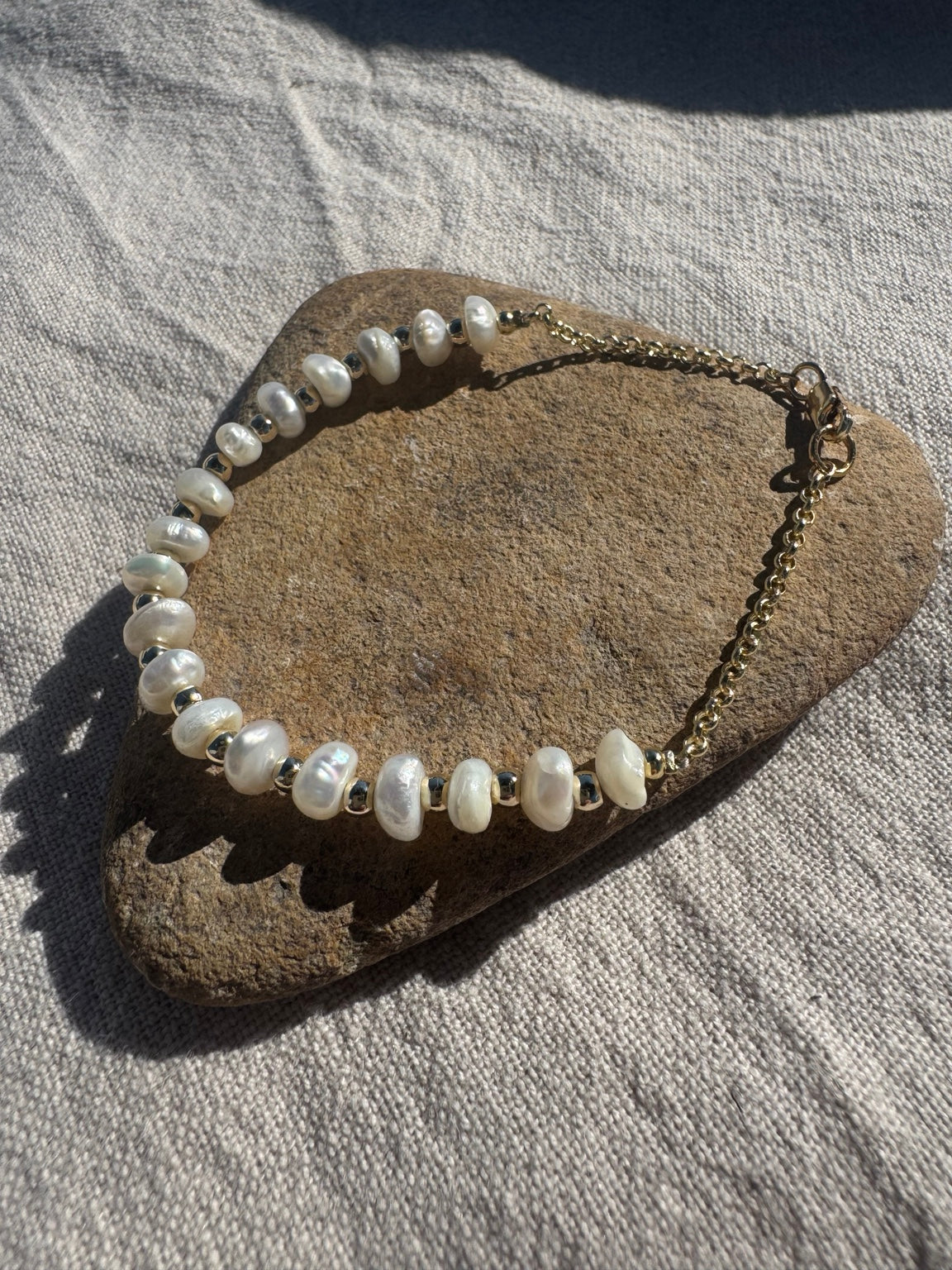 MILESTONES handmade freshwater pearl and 14k gold-filled bracelet on natural stone