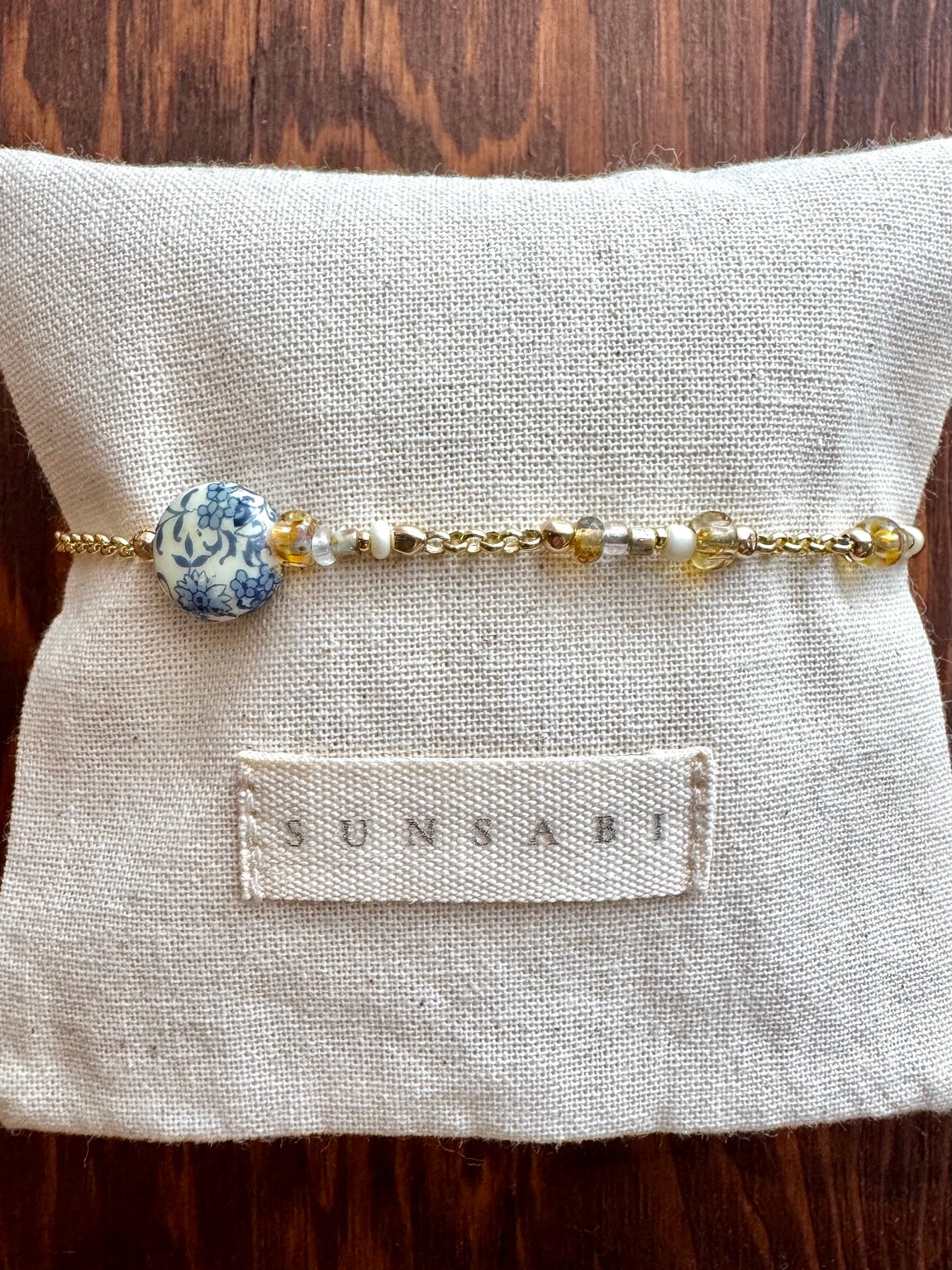 Portobello Indigo handmade asymmetrical bracelet with vintage Japanese Tensha bead, glass beads and 14kt gold-filled chain