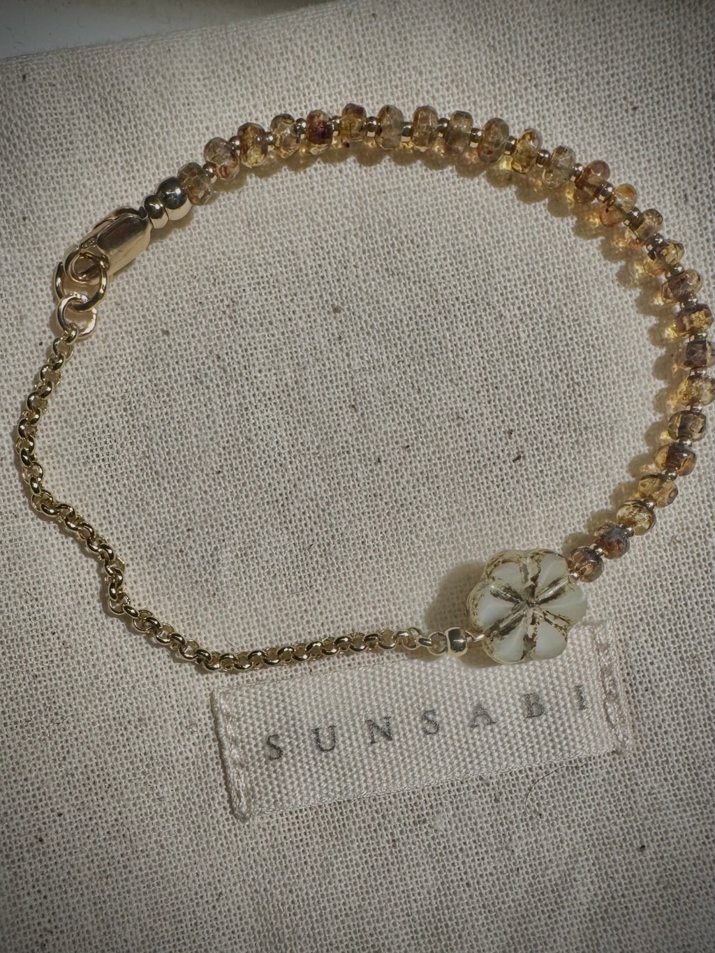 SUNSABI SUN BEAM child bracelet with honey-toned glass beads, Picasso floral glass focal and 14k gold-filled rolo chain