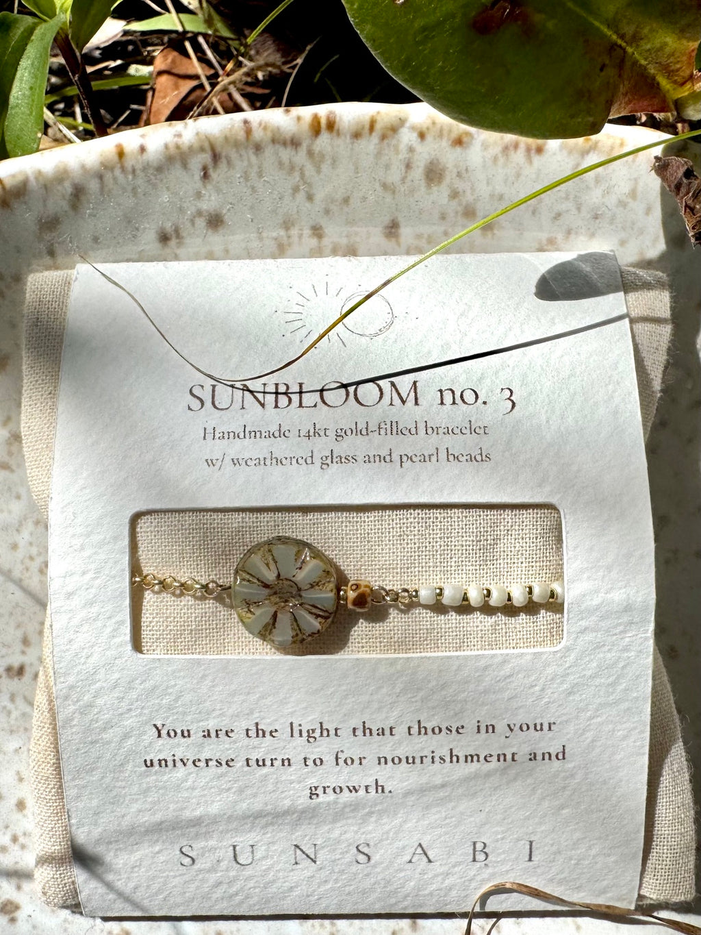 SUN BLOOM No. 03 handmade glass bead bracelet presented outdoors in SUNSABI story packaging