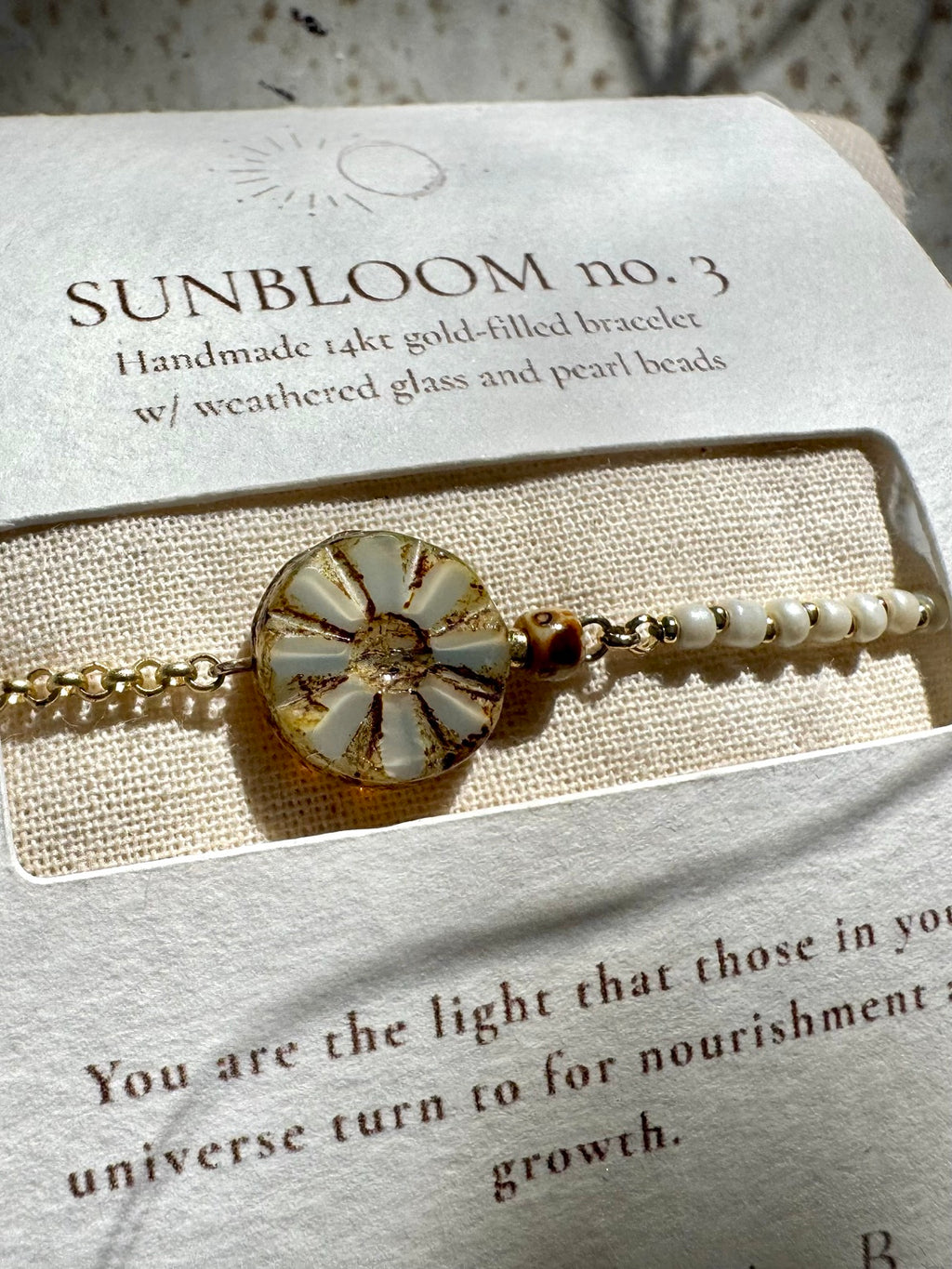 SUN BLOOM No. 03 handmade 14k gold-filled bracelet with ivory glass beads and a Picasso Czech bloom in SUNSABI packaging