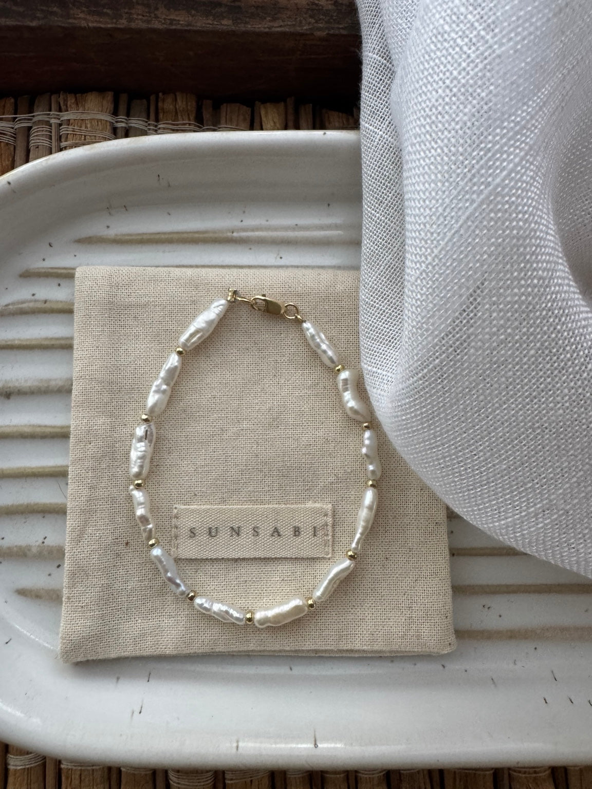 Full view of SUNSABI WHOLE irregular Biwa pearl bracelet